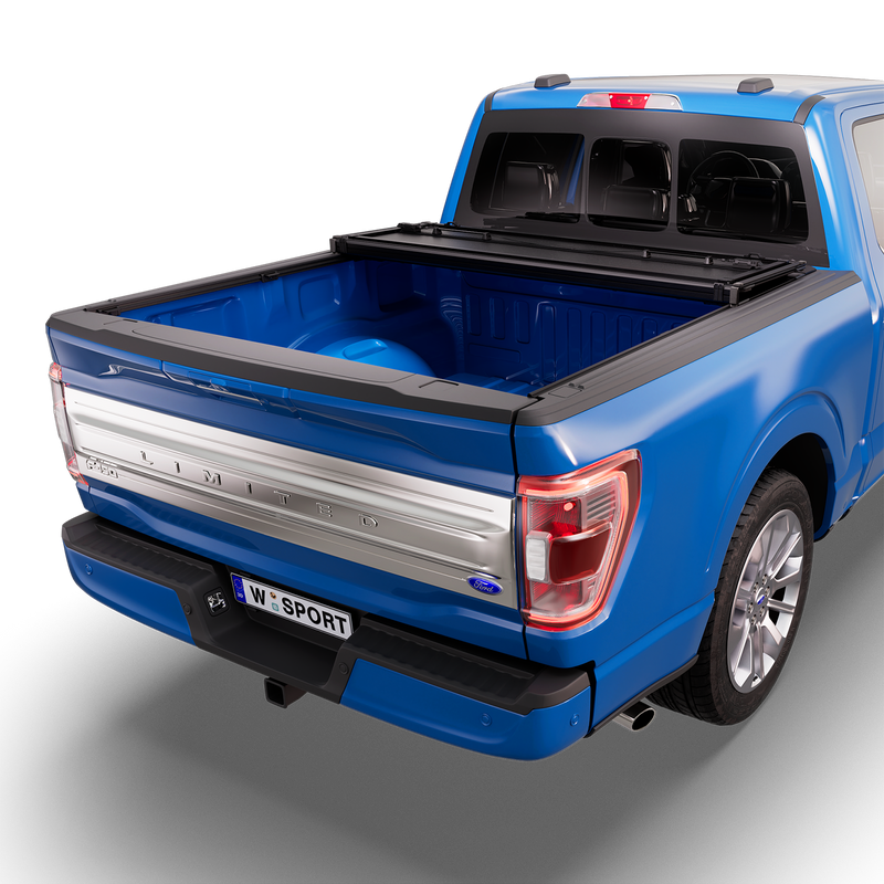 Worksport NEXUS hard folding tonneau cover shown on a 2021-23 Ford F-150, a newer generation than the trucks this listing fits: studio render with the cover folded twice into a stack at the cab end