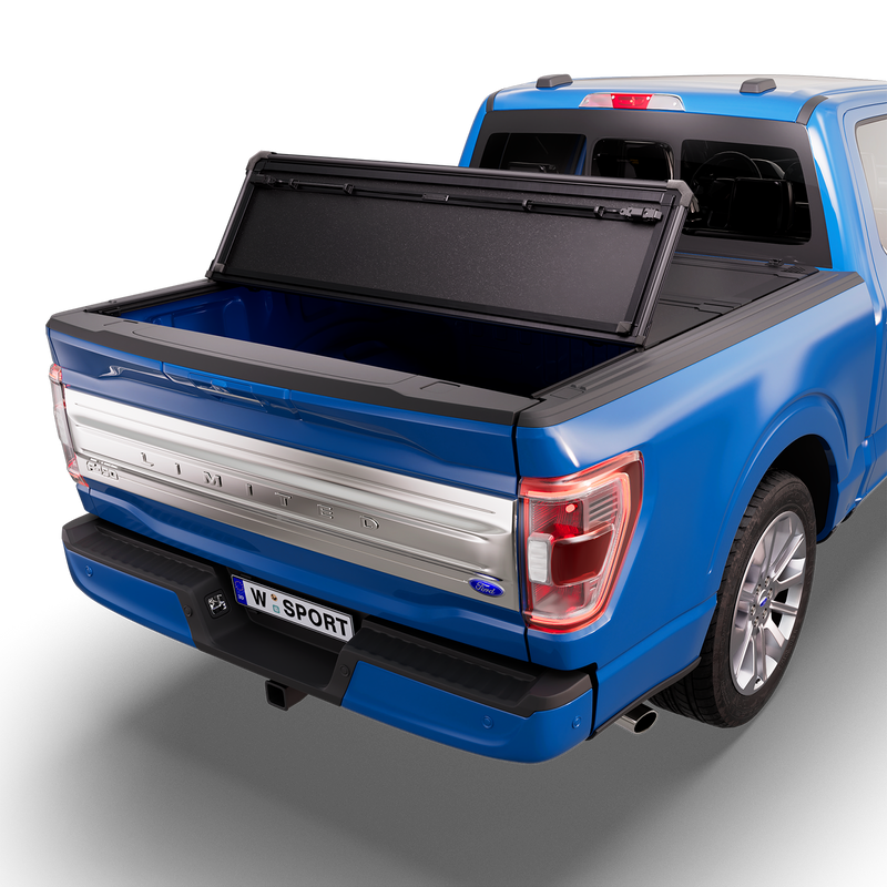 Worksport NEXUS hard folding tonneau cover shown on a 2021-23 Ford F-150, a newer generation than the trucks this listing fits: studio render with the cover folded once, rear of the bed open