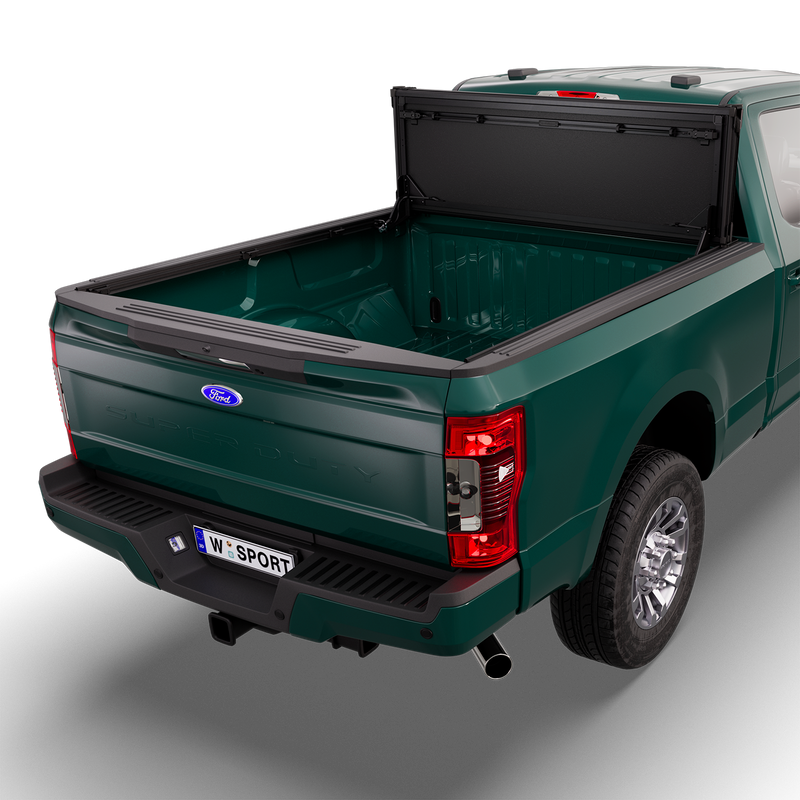 Worksport NEXUS hard folding tonneau cover on a pickup: 3D studio render of a green Ford F-250/F-350 Super Duty from the rear quarter with a black NEXUS hard folding tonneau cover folded stack flipped up vertical against the cab, full bed open