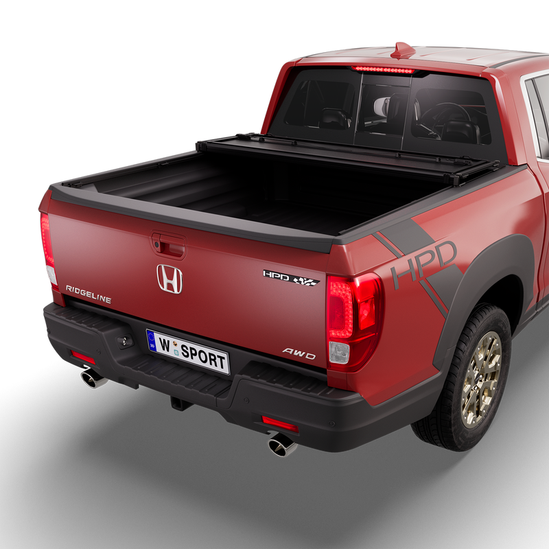 Worksport NEXUS hard folding tonneau cover on a pickup: 3D studio render of a red Honda Ridgeline from the rear quarter with a black NEXUS hard folding tonneau cover folded twice into a stack at the cab end, most of the bed open