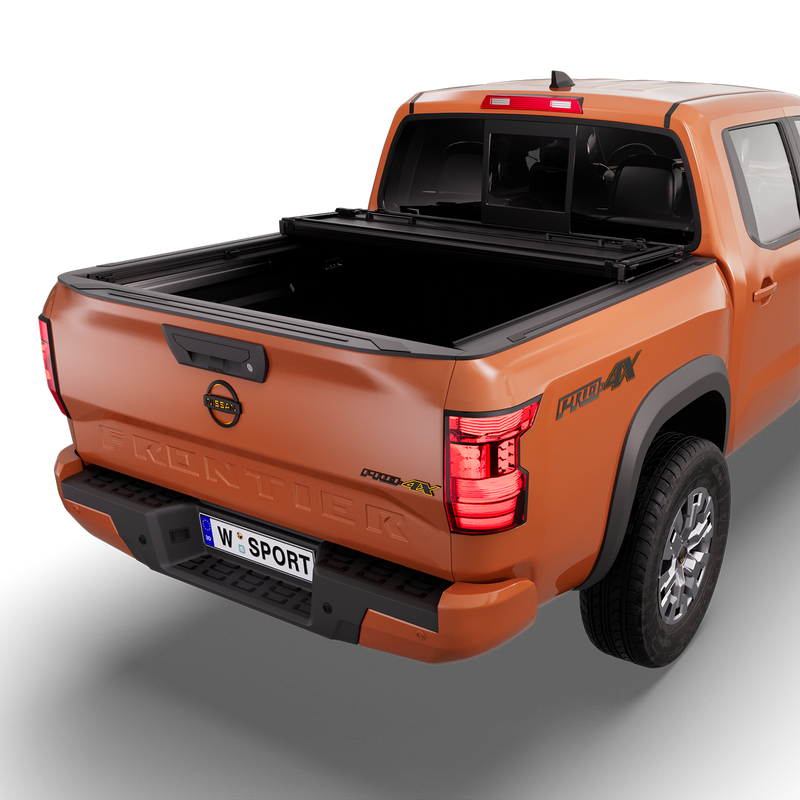 Worksport NEXUS hard folding tonneau cover on a pickup: 3D studio render of an orange Nissan Frontier from the rear quarter with a black NEXUS hard folding tonneau cover folded twice into a stack at the cab end, most of the bed open