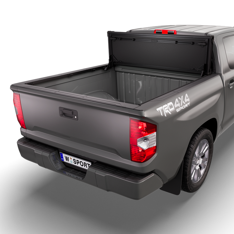 Worksport NEXUS hard folding tonneau cover shown on a 2014-21 Toyota Tundra, an older generation than the trucks this listing fits: studio render with the cover folded and flipped up against the cab, full bed open