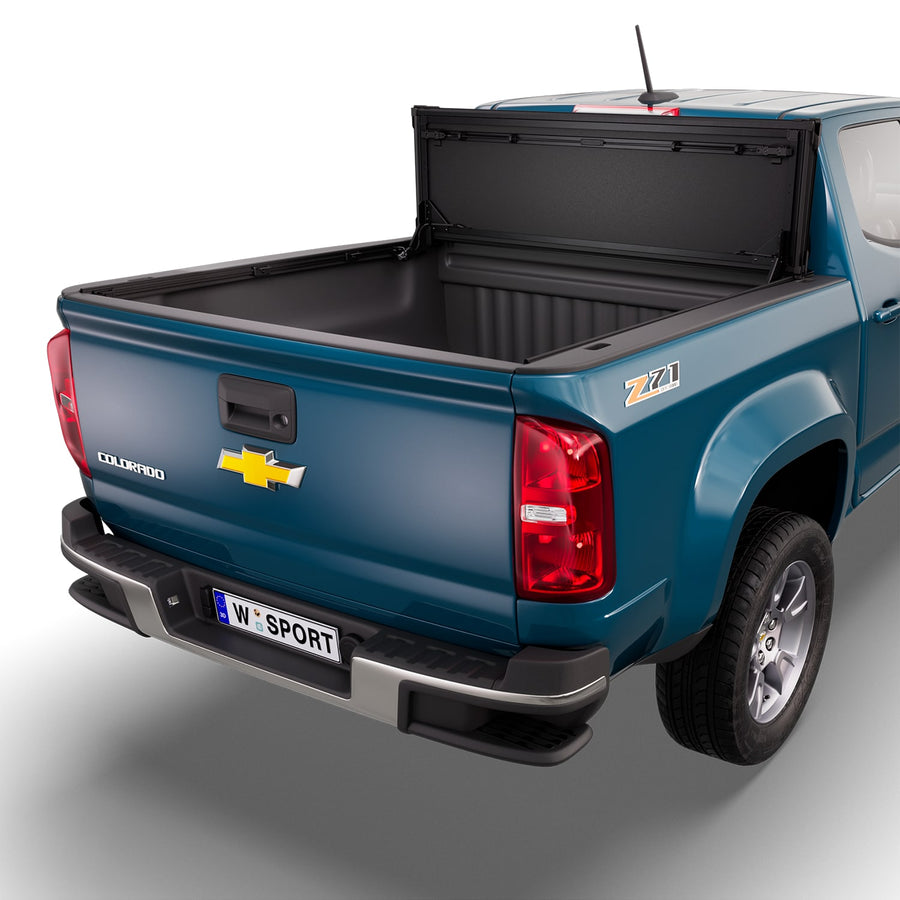 Worksport NEXUS hard folding tonneau cover folded and flipped up behind the cab, the bed open