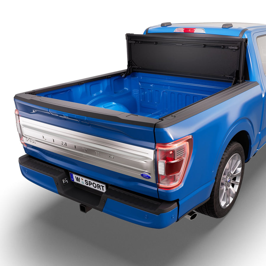 Worksport NEXUS hard folding tonneau cover folded and flipped up behind the cab, the bed open