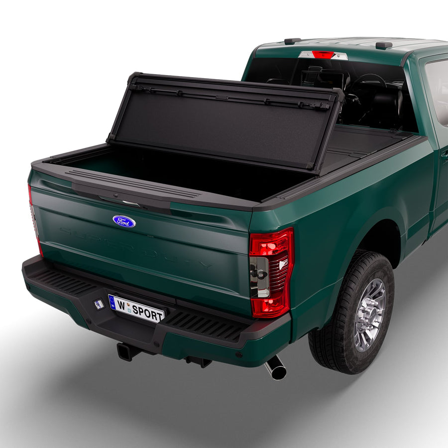 Worksport NEXUS hard folding tonneau cover with its panels partly folded toward the cab