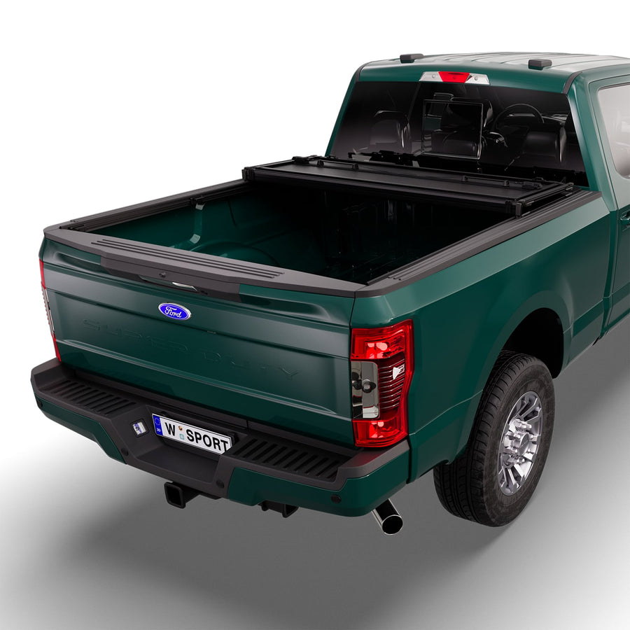 Worksport NEXUS hard folding tonneau cover with its panels partly folded toward the cab