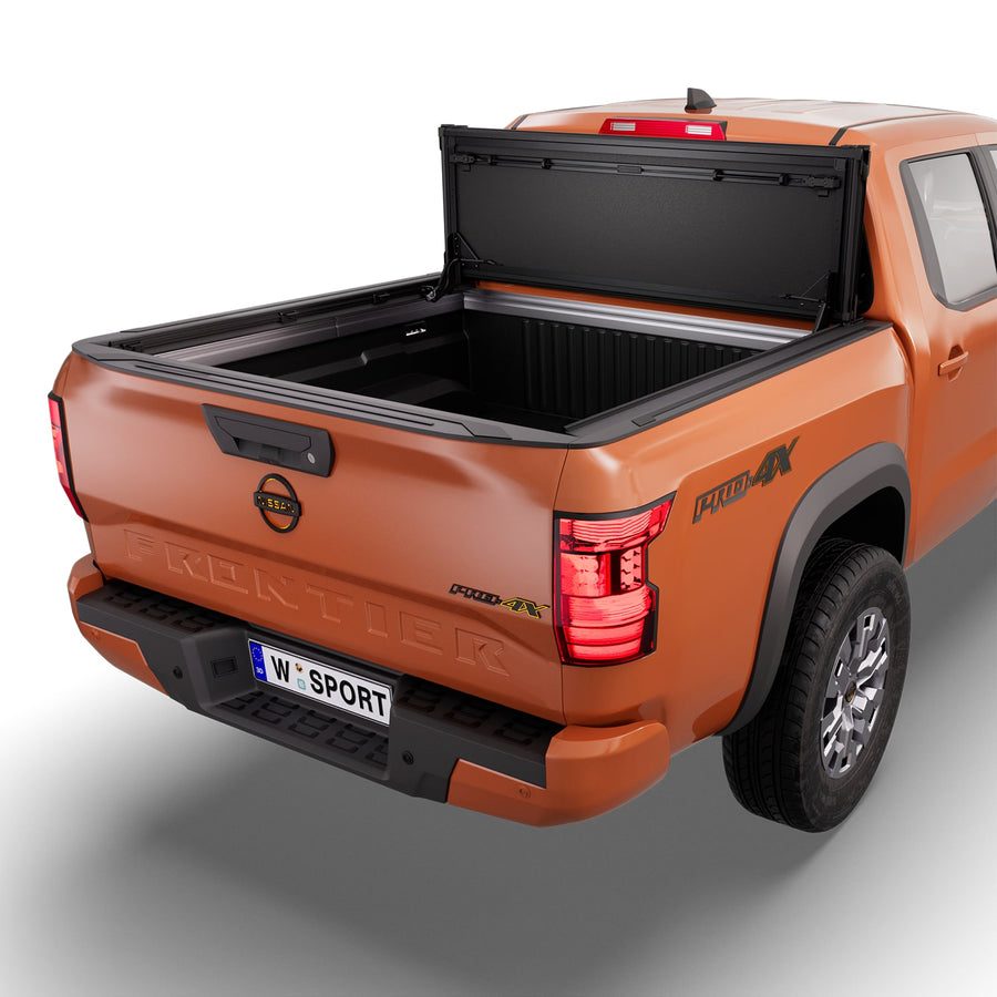 Worksport NEXUS hard folding tonneau cover folded and flipped up behind the cab, the bed open