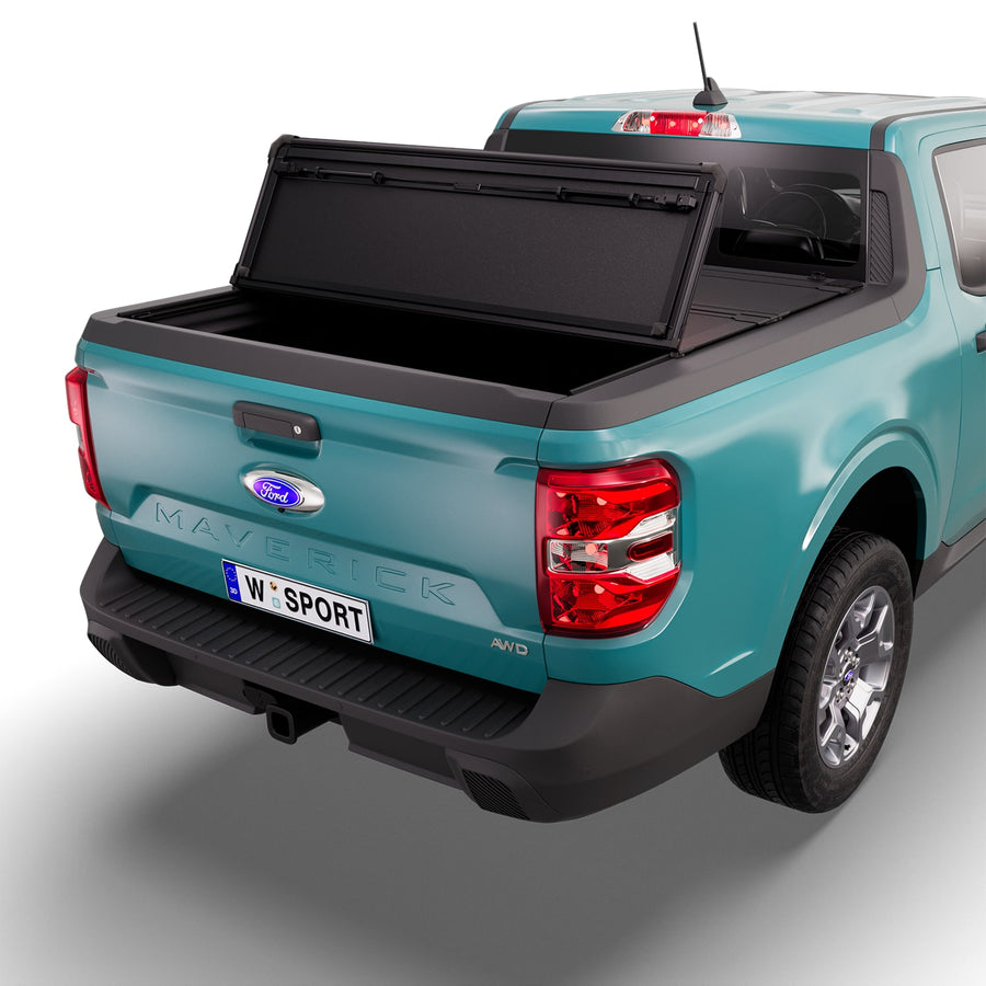 Worksport NEXUS hard folding tonneau cover with its panels partly folded toward the cab