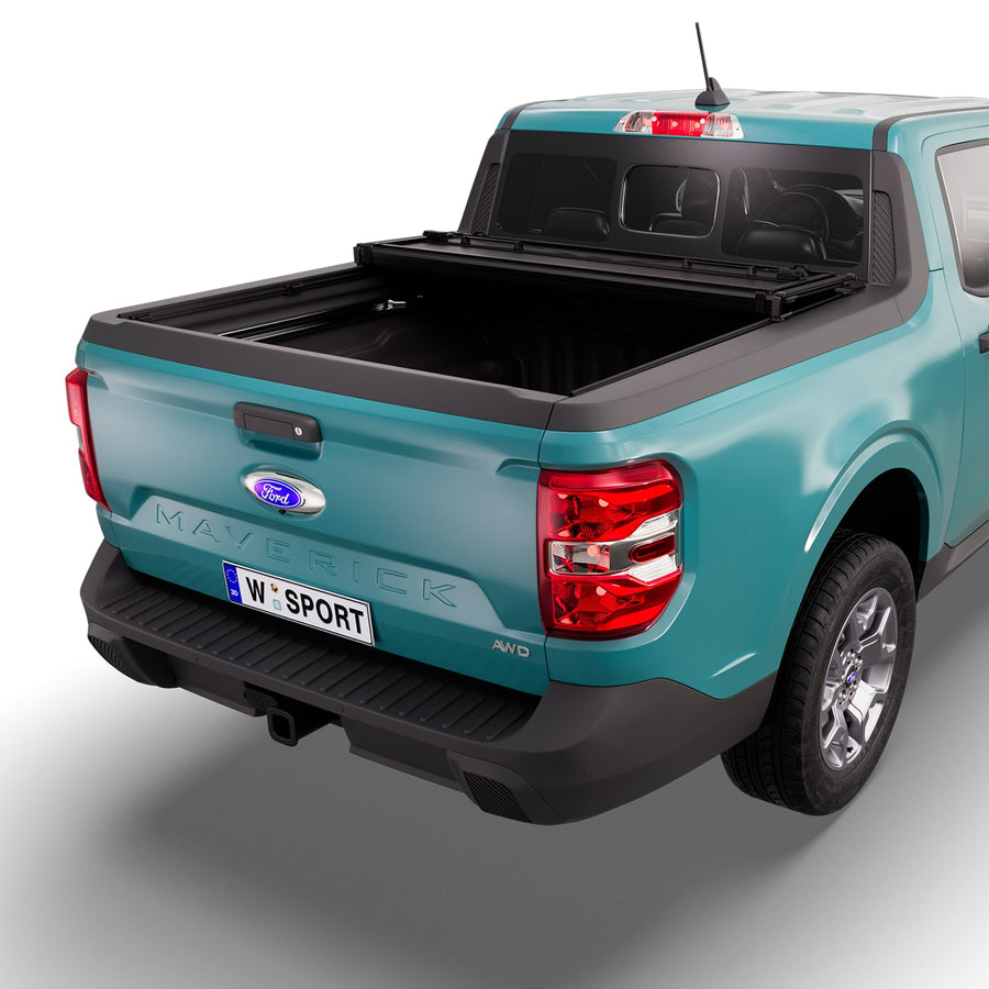 Worksport NEXUS hard folding tonneau cover with its panels partly folded toward the cab