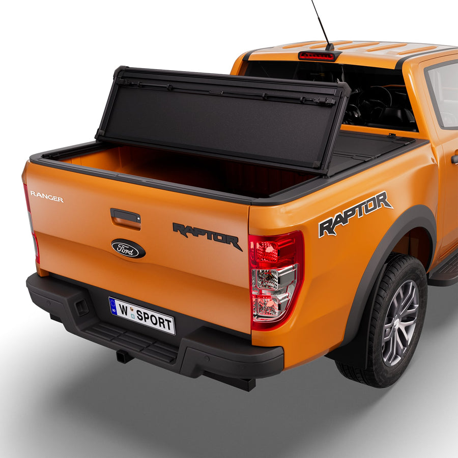 Worksport NEXUS hard folding tonneau cover with its panels partly folded toward the cab