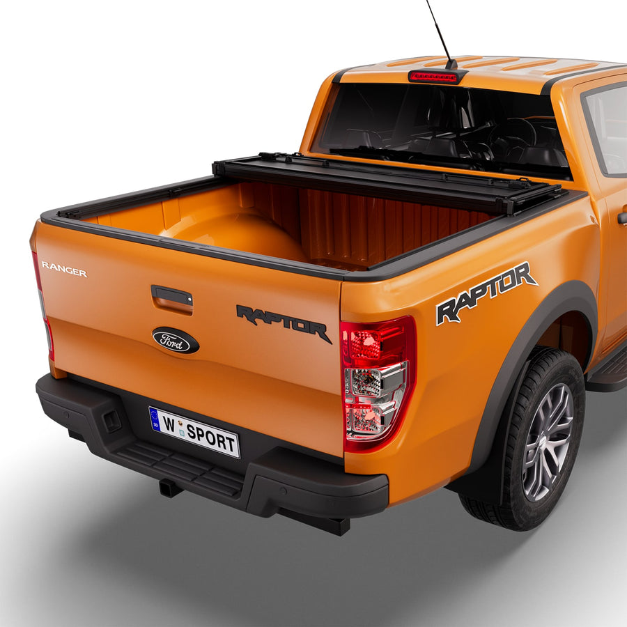 Worksport NEXUS hard folding tonneau cover with its panels partly folded toward the cab