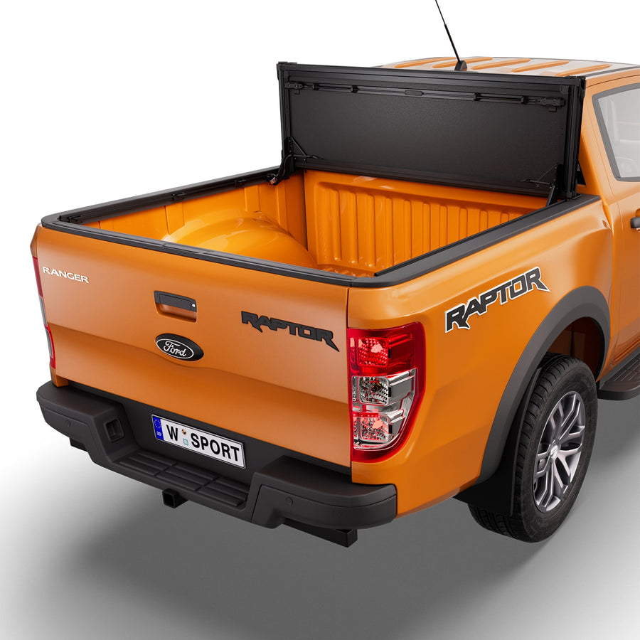 Worksport NEXUS hard folding tonneau cover folded and flipped up behind the cab, the bed open