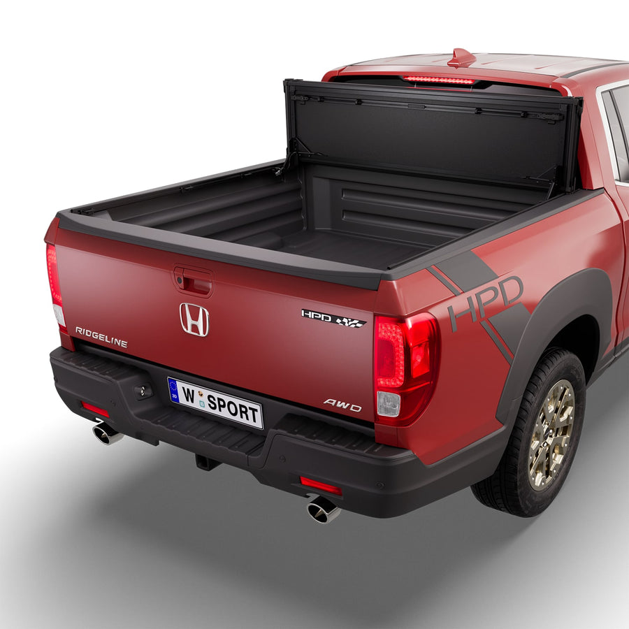 Worksport NEXUS hard folding tonneau cover folded and flipped up behind the cab, the bed open