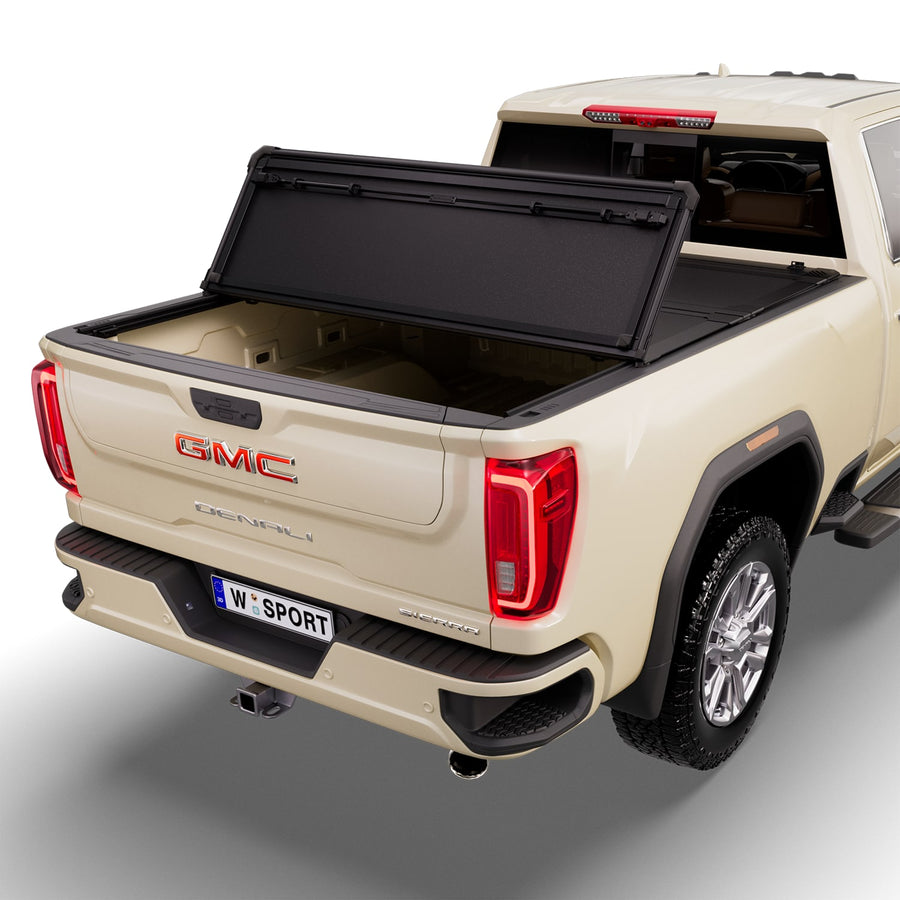 Worksport NEXUS hard folding tonneau cover with its panels partly folded toward the cab