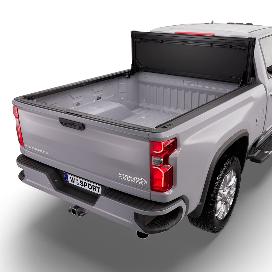 Worksport NEXUS hard folding tonneau cover folded and flipped up behind the cab, the bed open