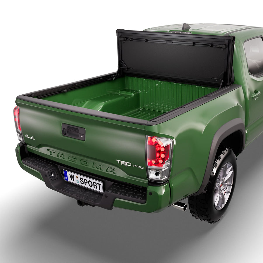Worksport NEXUS hard folding tonneau cover folded and flipped up behind the cab, the bed open