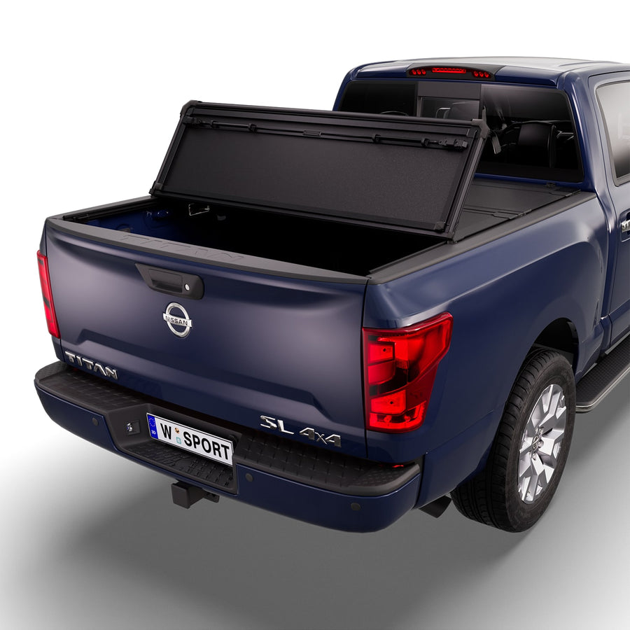 Worksport NEXUS hard folding tonneau cover with its panels partly folded toward the cab